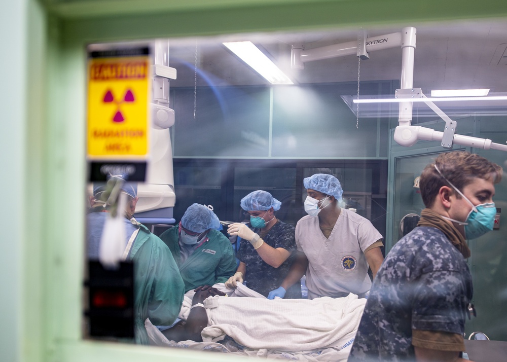 USNS Mercy Sailors Treat Patient