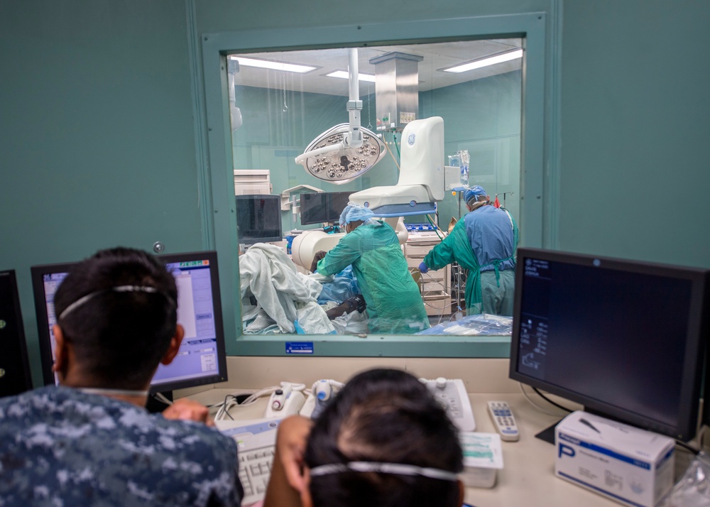 USNS Mercy Sailors Treat Patient