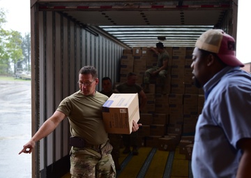 Arkansas National Guardsmen unload trailers with PPE for Arkansas counties
