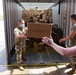 Arkansas National Guardsmen unload trailers with PPE for Arkansas counties