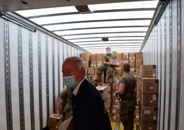 Arkansas National Guardsmen unload trailers with PPE for Arkansas counties