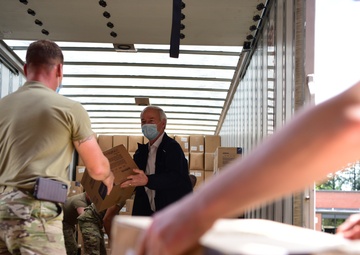 Arkansas National Guardsmen unload trailers with PPE for Arkansas counties