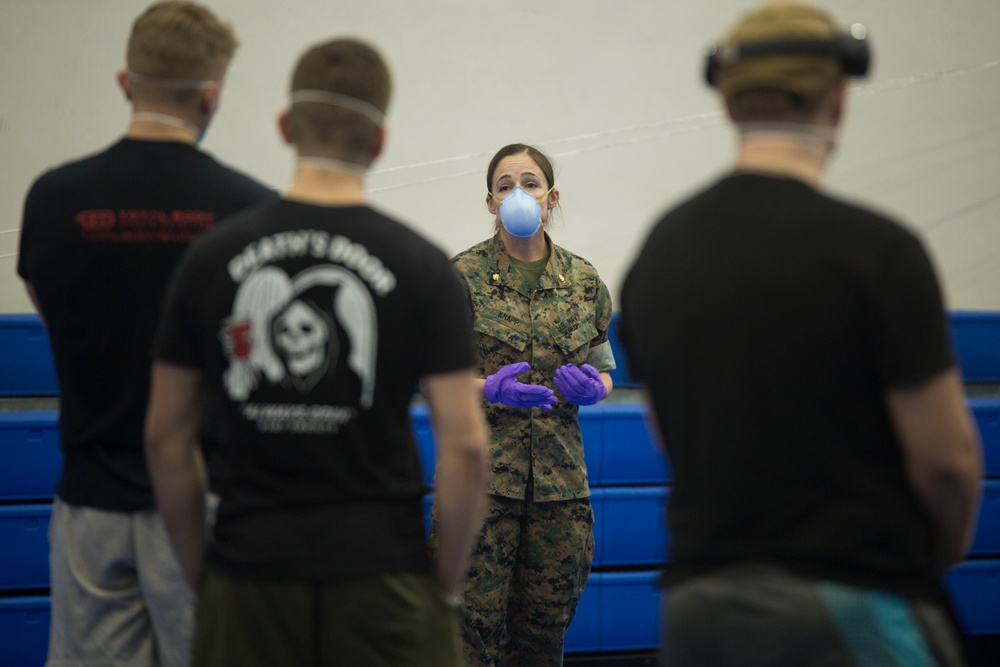 US Sailors with 3rd Medical Bn screen USS Theodore Roosevelt Sailors for COVID-19 symptoms