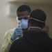 US Sailors with 3rd Medical Bn screen USS Theodore Roosevelt Sailors for COVID-19 symptoms