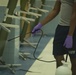 3rd Medical Battalion Corpsman sanitize facility for USS Theodore Roosevelt Sailors