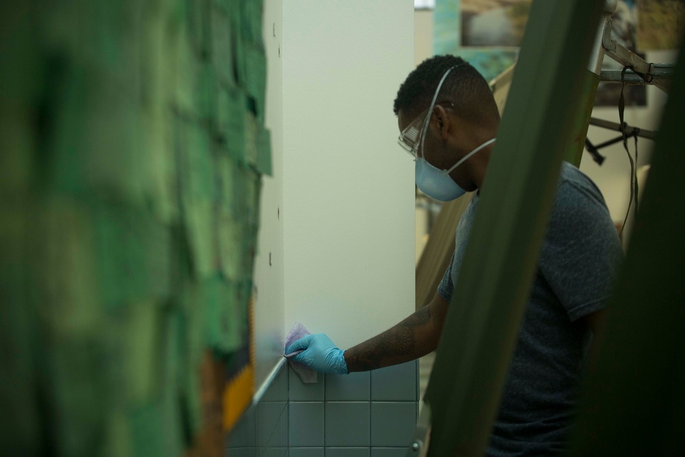 3rd Medical Battalion Corpsman sanitize facility for USS Theodore Roosevelt Sailors