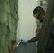 3rd Medical Battalion Corpsman sanitize facility for USS Theodore Roosevelt Sailors