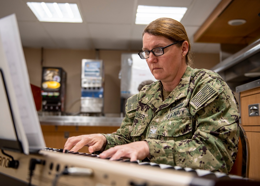 USNS Mercy Sailor Plays a Digital Piano Prior to Easter Sunday Services