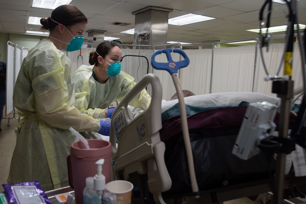 Sailors Monitor Patient