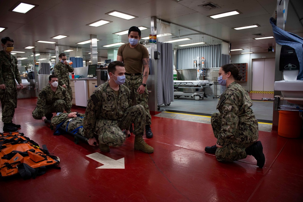 USNS Comfort (T-AH 20) Sailors Practice Patient Transport Protocol
