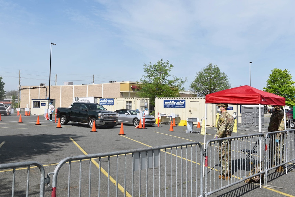 La National Guard assist with traffic control for drive through testing