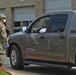 La National Guard assist with traffic control for drive through testing