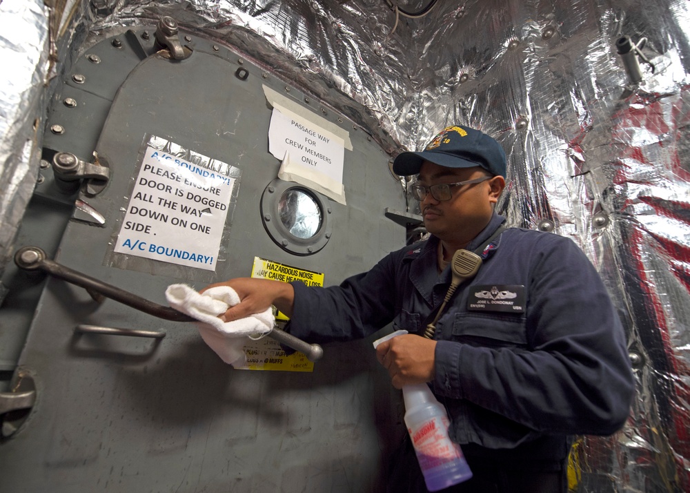 Sailors Sanitize USS Gabrielle Giffords