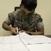 Mask Marines | Marines from Camp Operations aid in the making of masks for service members