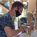Sailor Checks Oxygen Tank