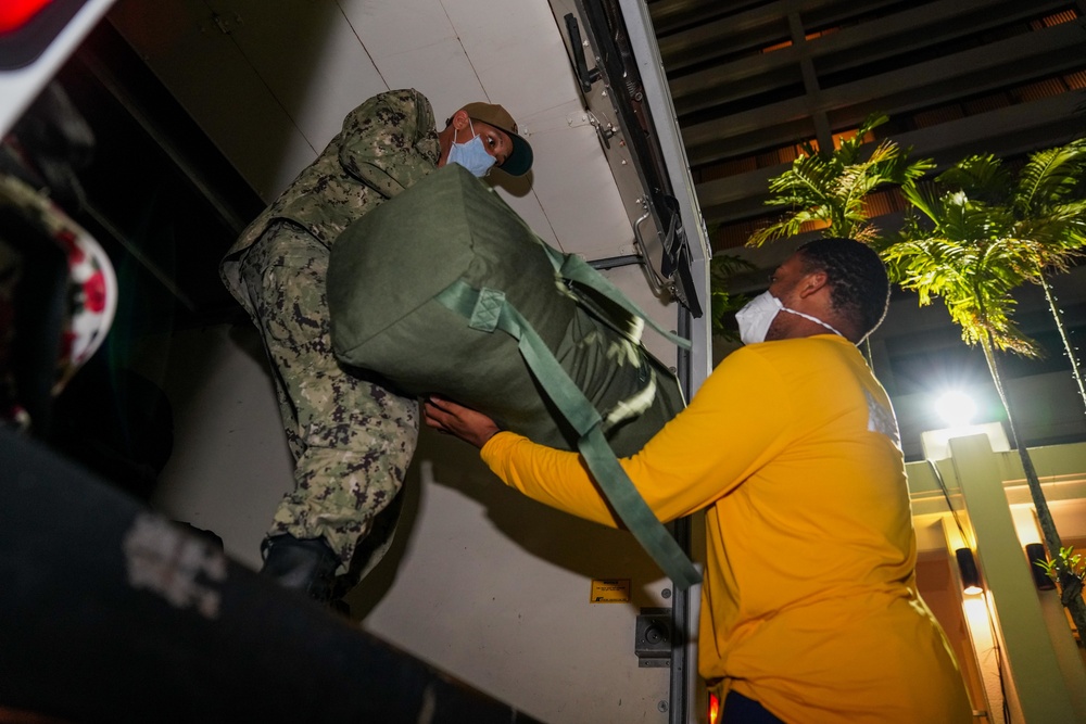 USS Theodore Roosevelt Sailors Check into Commercial Lodging