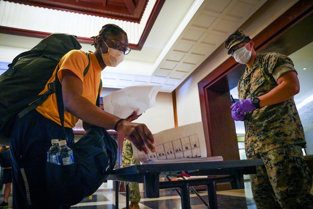 USS Theodore Roosevelt Sailors Check into Commercial Lodging