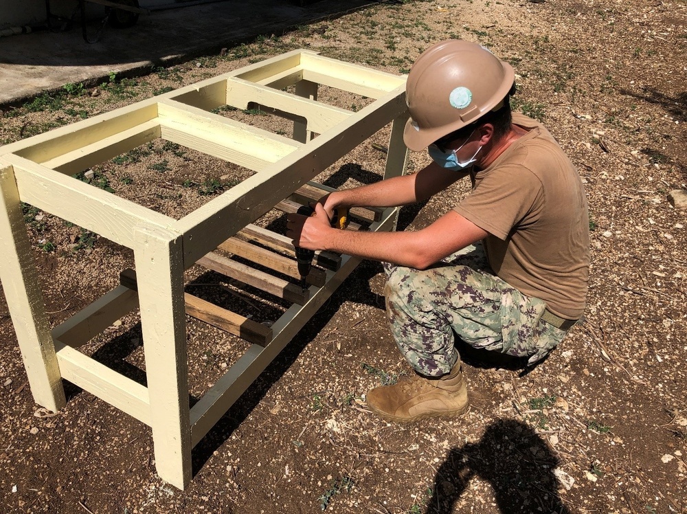 U.S. Navy Seabees with NMCB-5’s Detail Tinian build sinks for health care workers