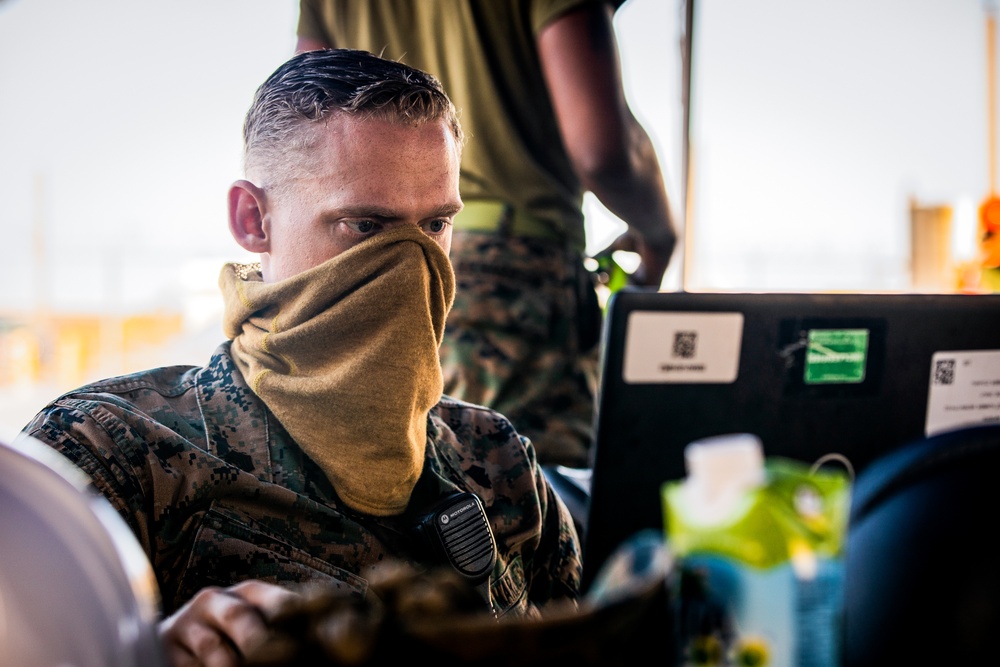 U.S. Marines and Sailors Offload EMF from USNS DAHL