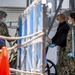 USNS Mercy Sailors Disembark a Patient