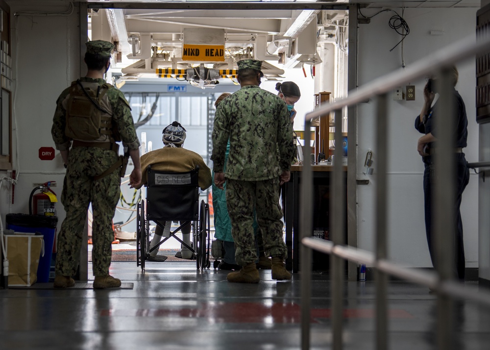 USNS Sailors Prepare to Disembark Patient