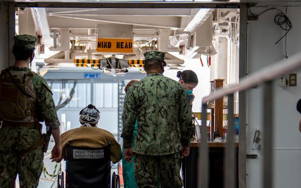 USNS Sailors Prepare to Disembark Patient