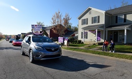 Teachers parade through Fort Knox neighborhoods on Purple Up Day to encourage military students