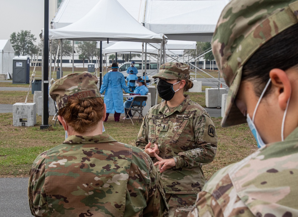 715 Military Police company commander gives tour of Orange County Convention Center Community Based Testing Site