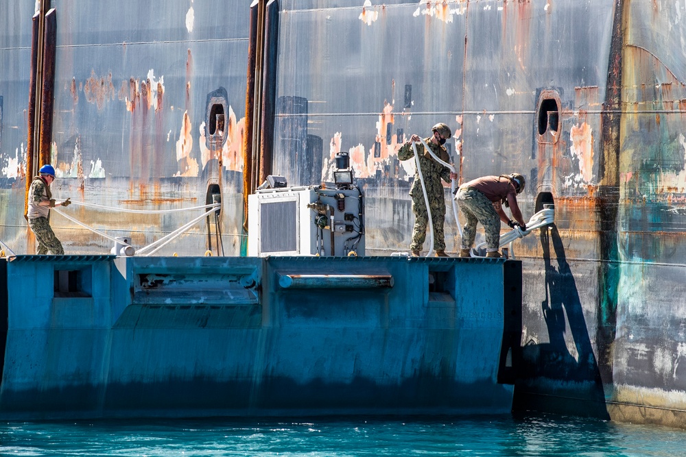 Sailors and Marines Offload EMF From USNS DAHL