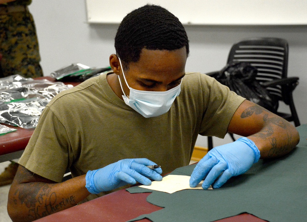 Aerial Delivery instructors, students make face coverings, surgical masks