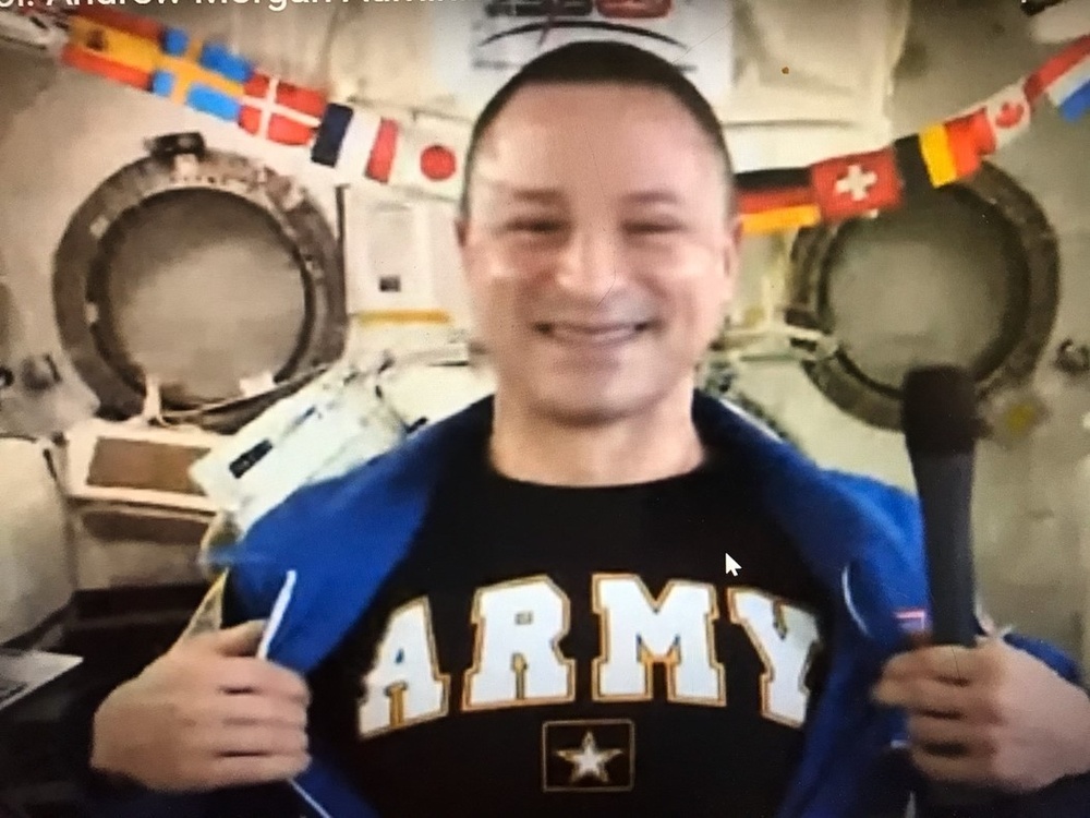 Army physician Col. Andrew Morgan administers oath of enlistment from the International Space Station