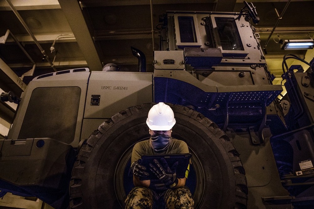 Marines with 3rd MLG Rearrange Heavy Equipment aboard USNS Dahl