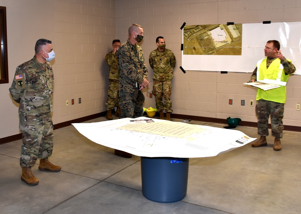 The deputy commanding general, 2nd Marine Expeditionary Brigade speaks with Rhode Island National Guard command staff