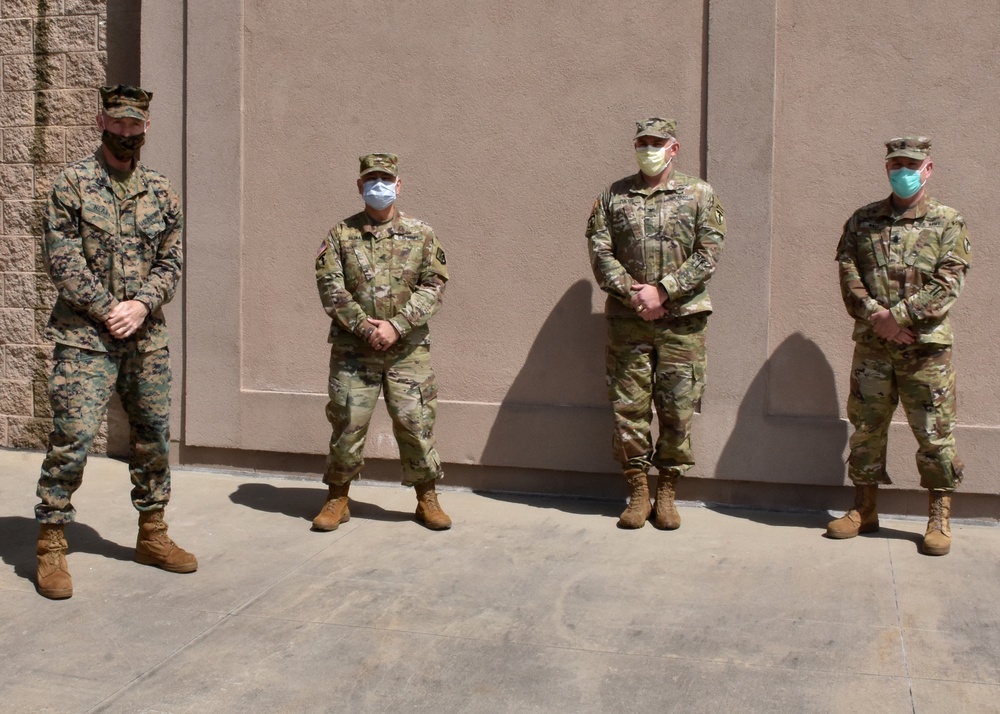 The deputy commanding general, 2nd Marine Expeditionary Brigade speaks with Rhode Island National Guard command staff