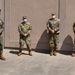 The deputy commanding general, 2nd Marine Expeditionary Brigade speaks with Rhode Island National Guard command staff