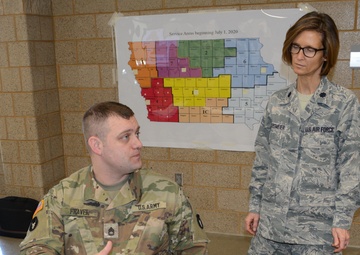 Sgt. First Class Anthony Fravel talks with Lt. Colonel Debbie Jacobsmeier