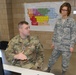 Sgt. First Class Anthony Fravel talks with Lt. Colonel Debbie Jacobsmeier