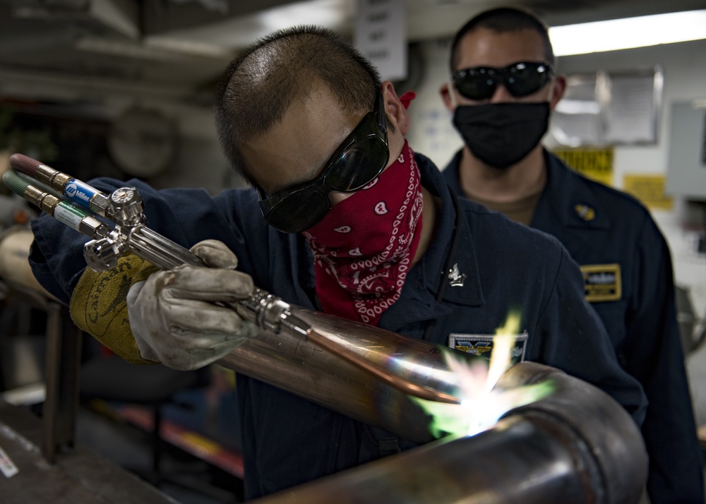 USS Carl Vinson (CVN 70) Hull Technicians Braze Potable Water Pipe
