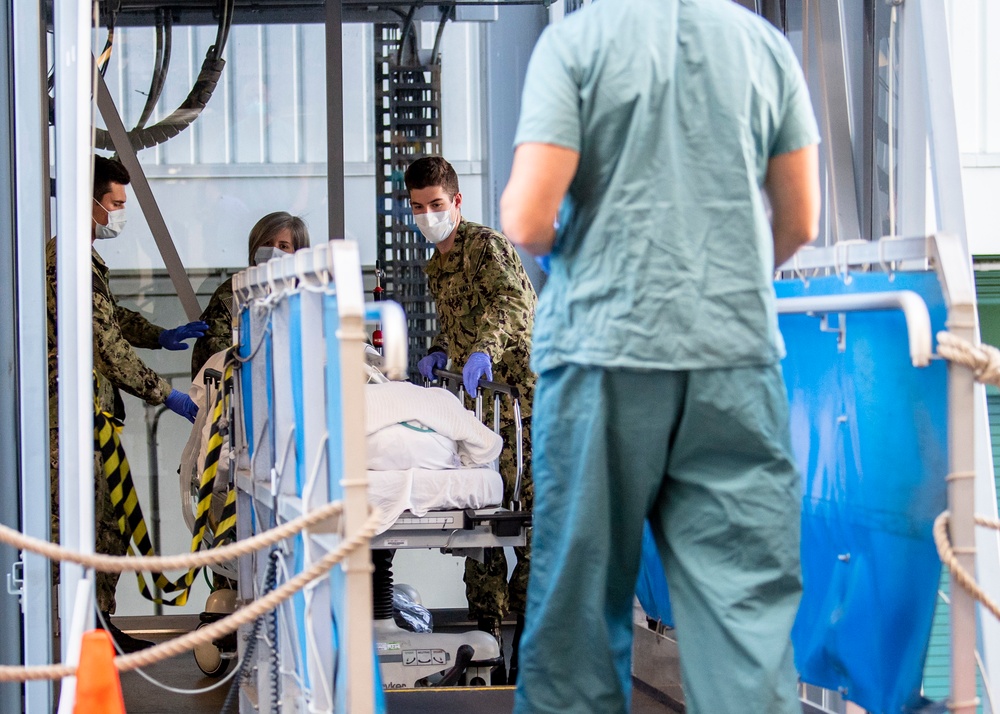 USNS Mercy Sailors Transport Patient