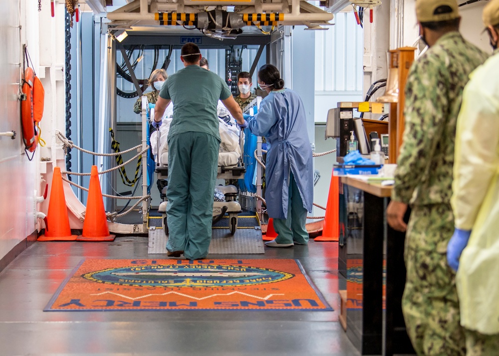 USNS Mercy Sailors Transport Patient