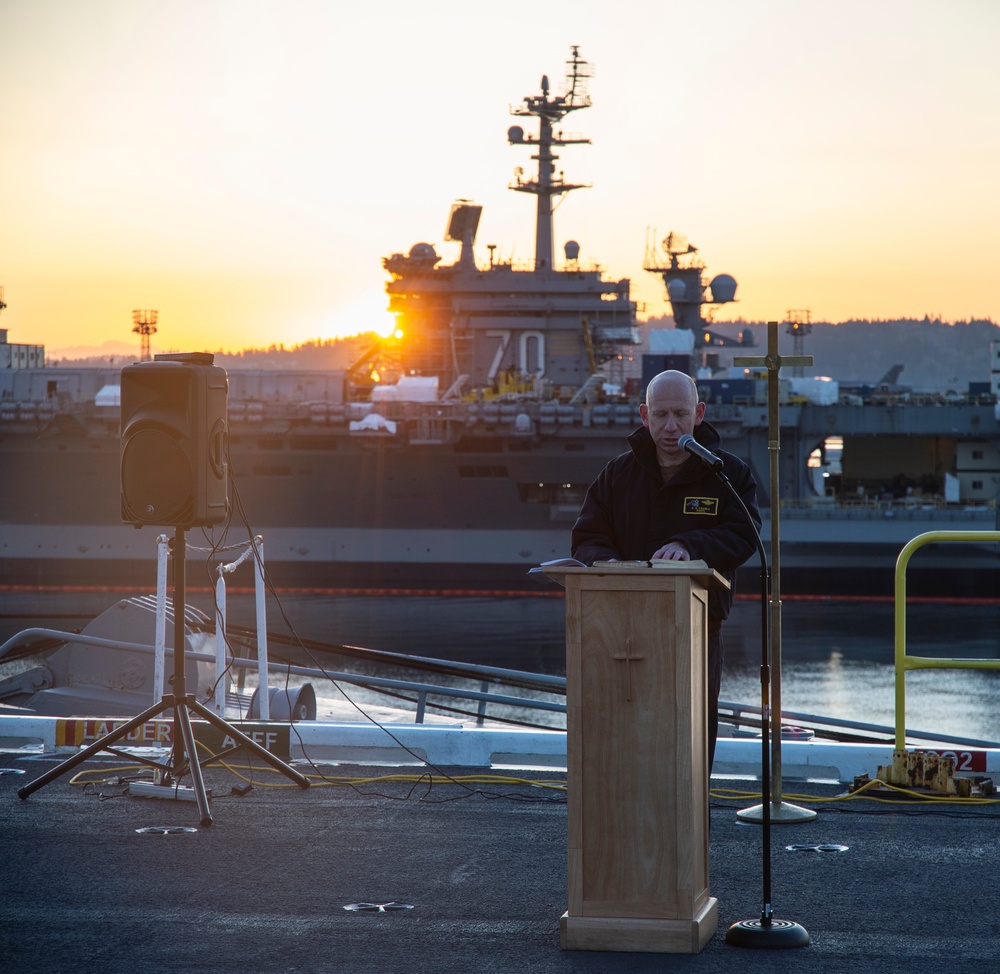 A Nimitz Chaplain Leads Prayer In Easter Sunday Sunrise Service