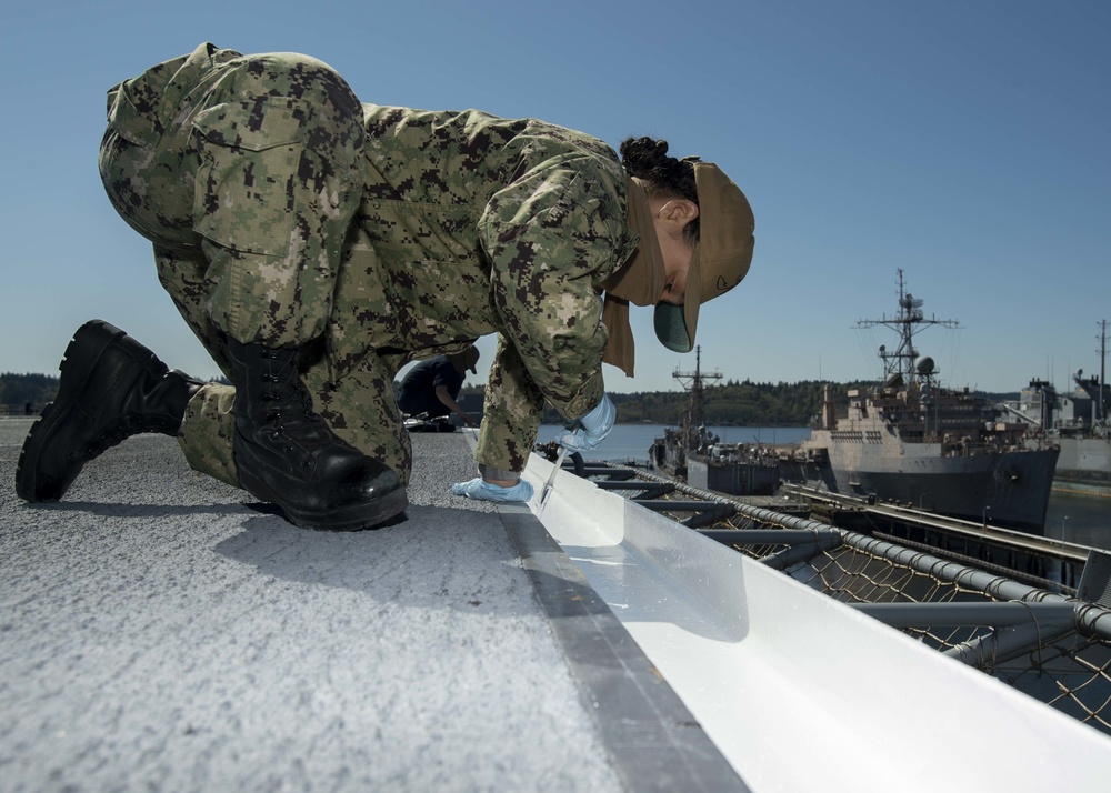 Nimitz Sailor Paints Flight Deck