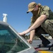 Nimitz Sailor Cleans Bubble On Flight Deck
