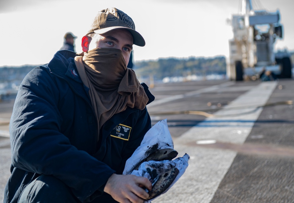 Nimitz Sailor Cleans Cover Plate