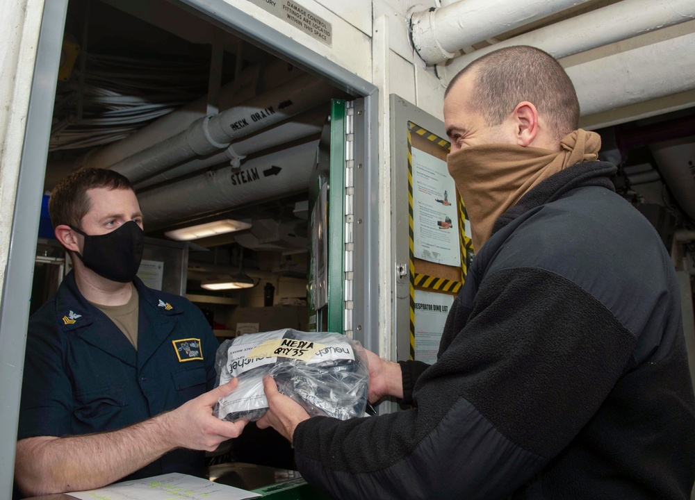 Nimitz Sailor Gives Mask