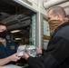 Nimitz Sailor Gives Mask