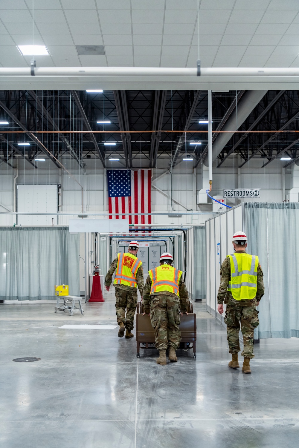 Michigan National Guard members place beds at COVID-19 alternate care facility