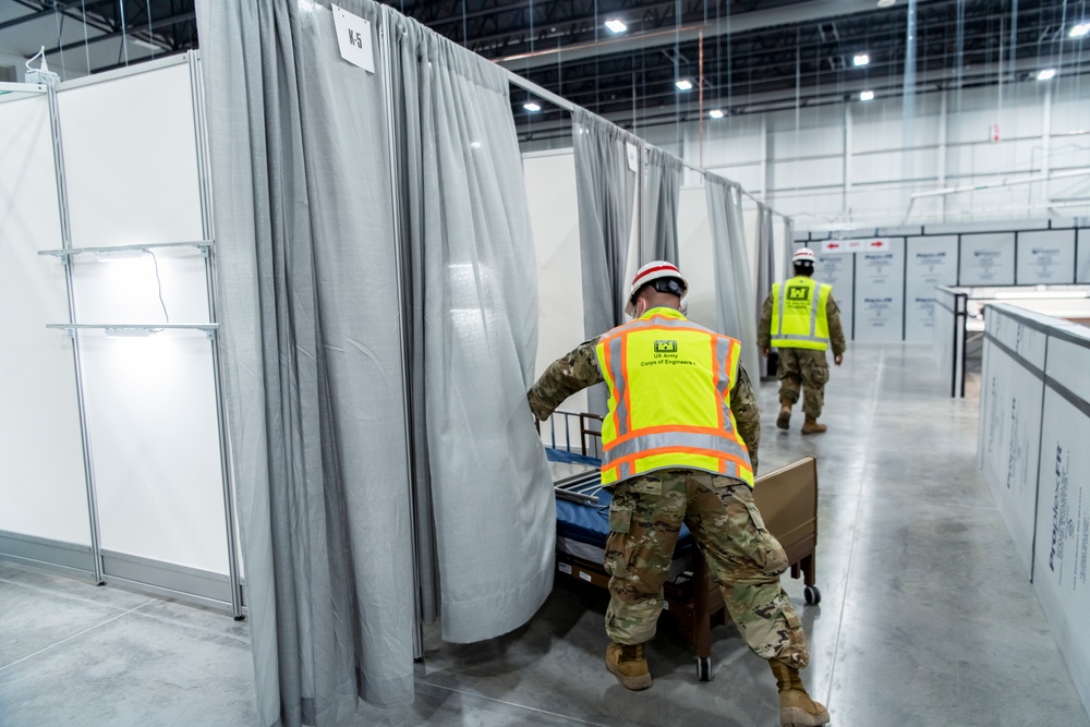 Michigan National Guard members place beds at COVID-19 alternate care facility