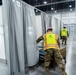 Michigan National Guard members place beds at COVID-19 alternate care facility