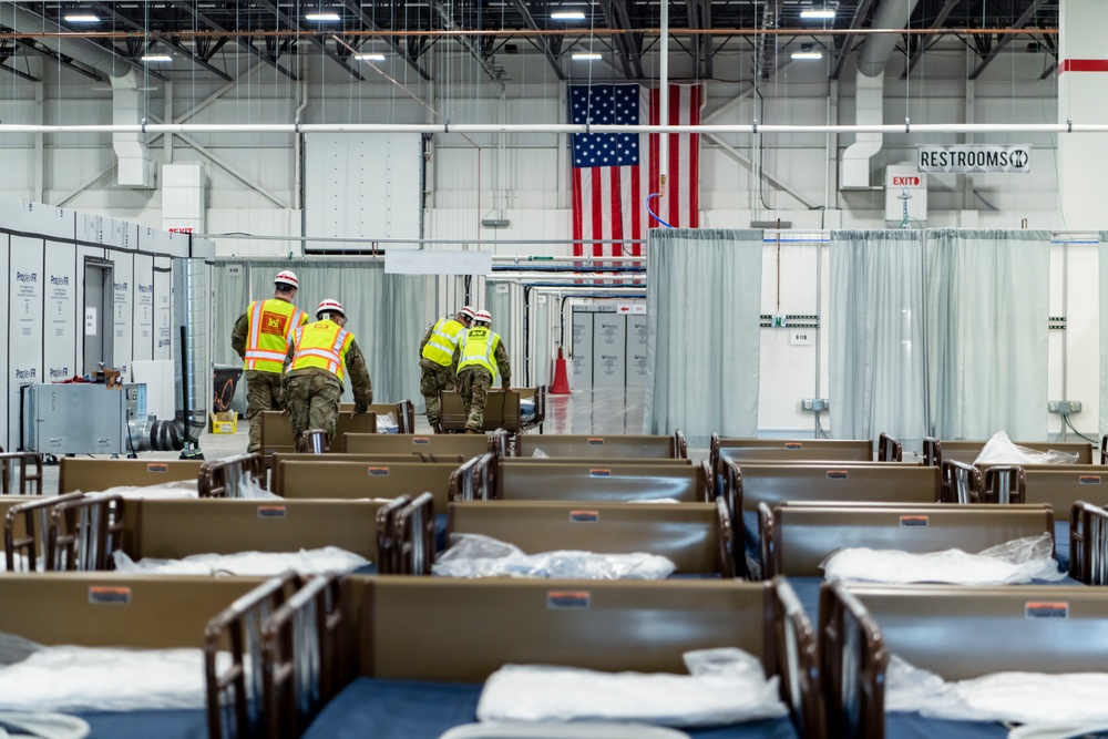 Michigan National Guard members place beds at COVID-19 alternate care facility